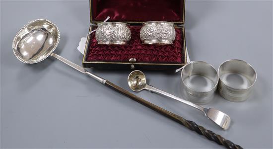 Two pairs of silver napkin rings (one cased), a George III ladle and a Georgian punch ladle with whale bone handle